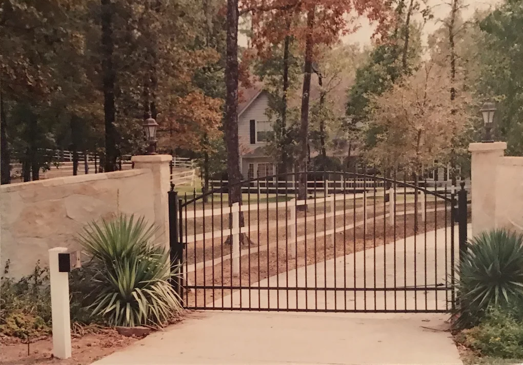 Estate entrance gate with stone columns