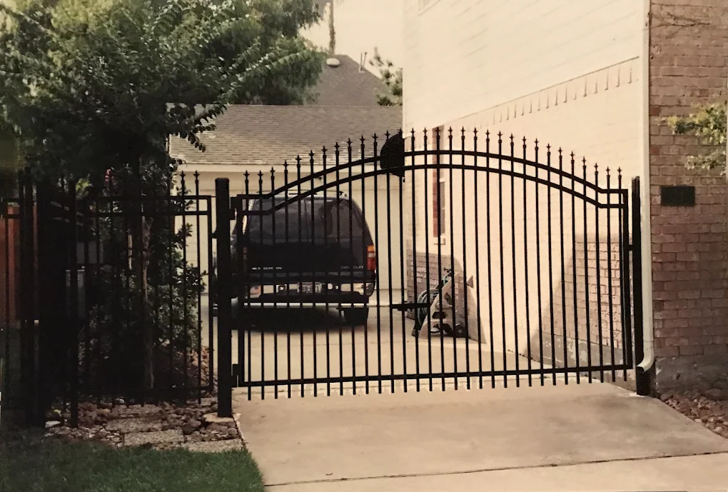 Ornamental arched driveway gate