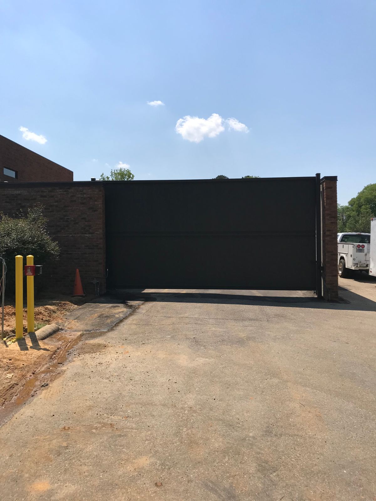 Wide steel gate securing entrance to judges parking lot at Chesterfield Judicial System