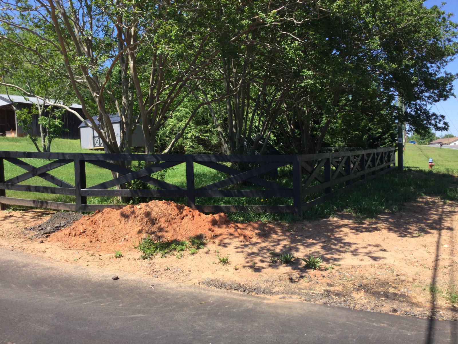 Black cross-rail fence corner section