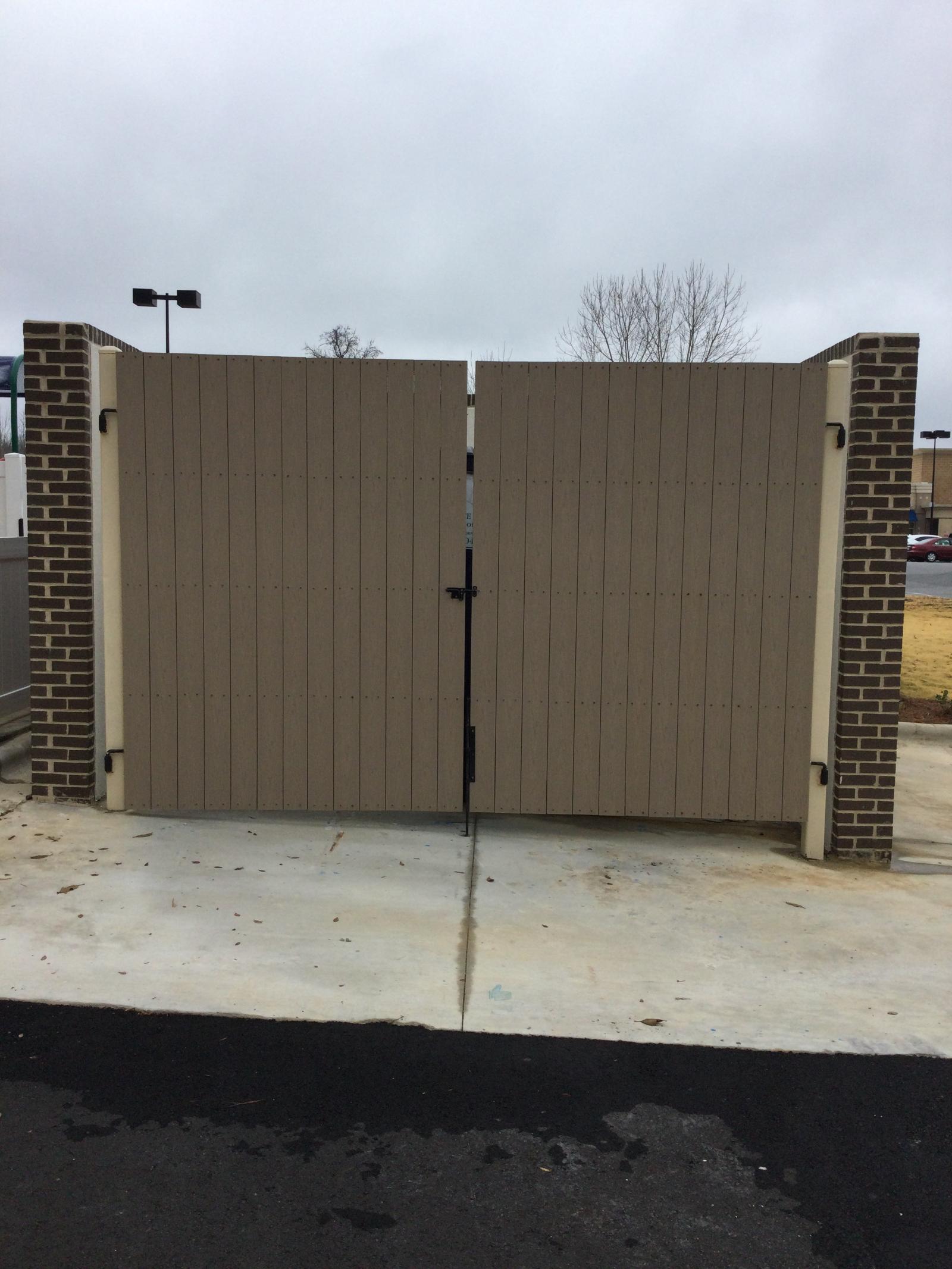 Composite dumpster enclosure gates at daycare facility