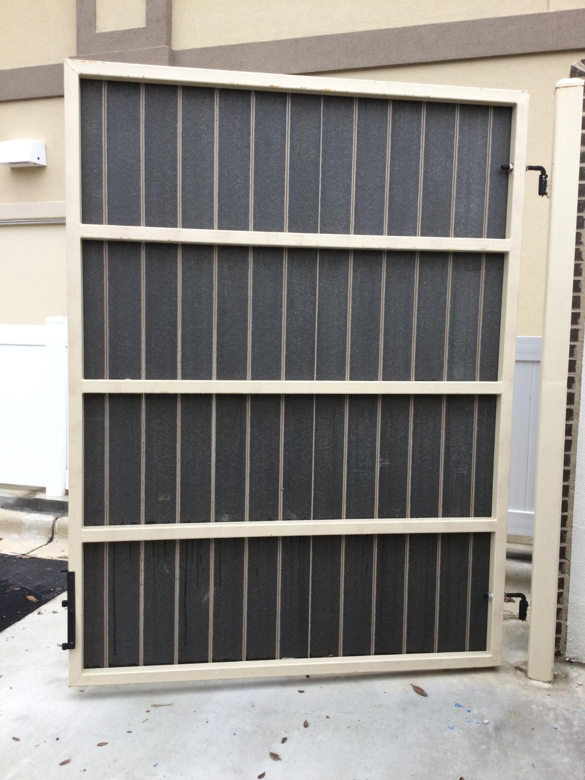 Framed screened service gate at daycare facility