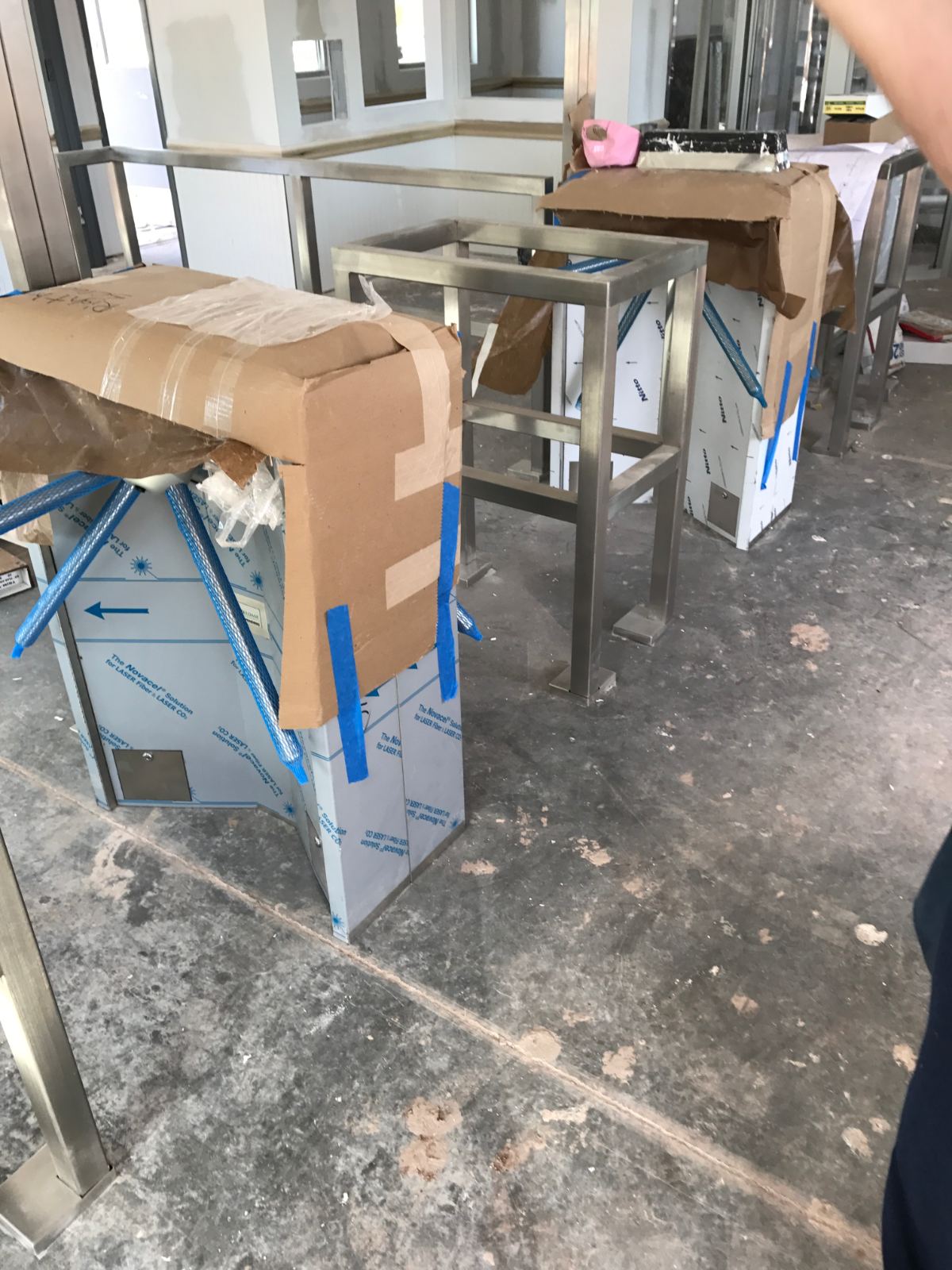 Stainless steel turnstile pedestals under construction at FedEx facility
