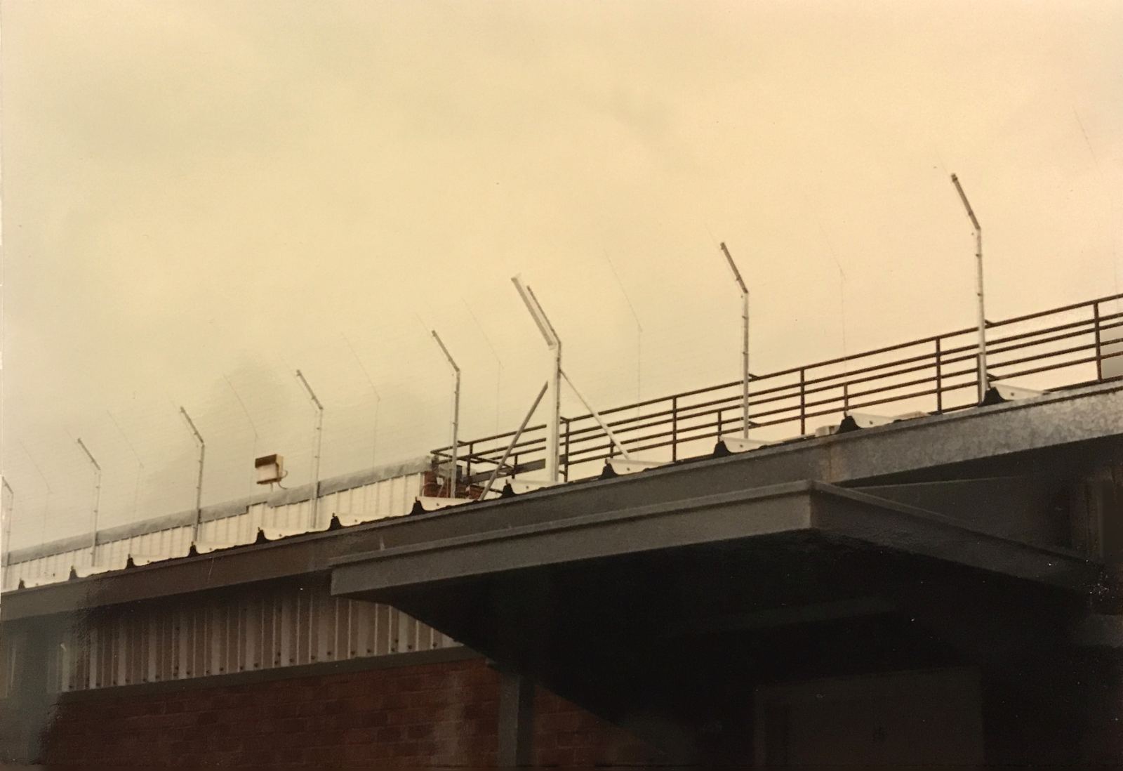 Angled electric security fence along Huntsville Walls Unit rooftop