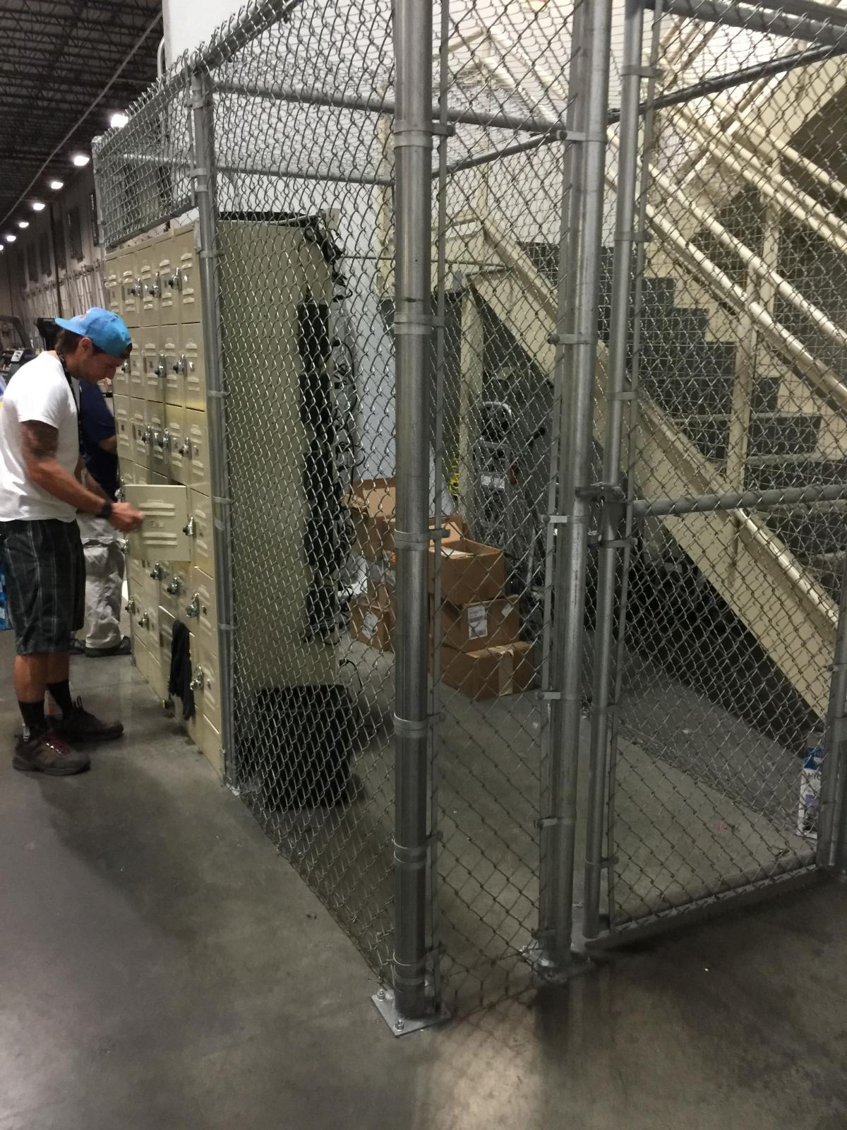 8-foot-high chain link interior enclosure with walk gate and enclosed top