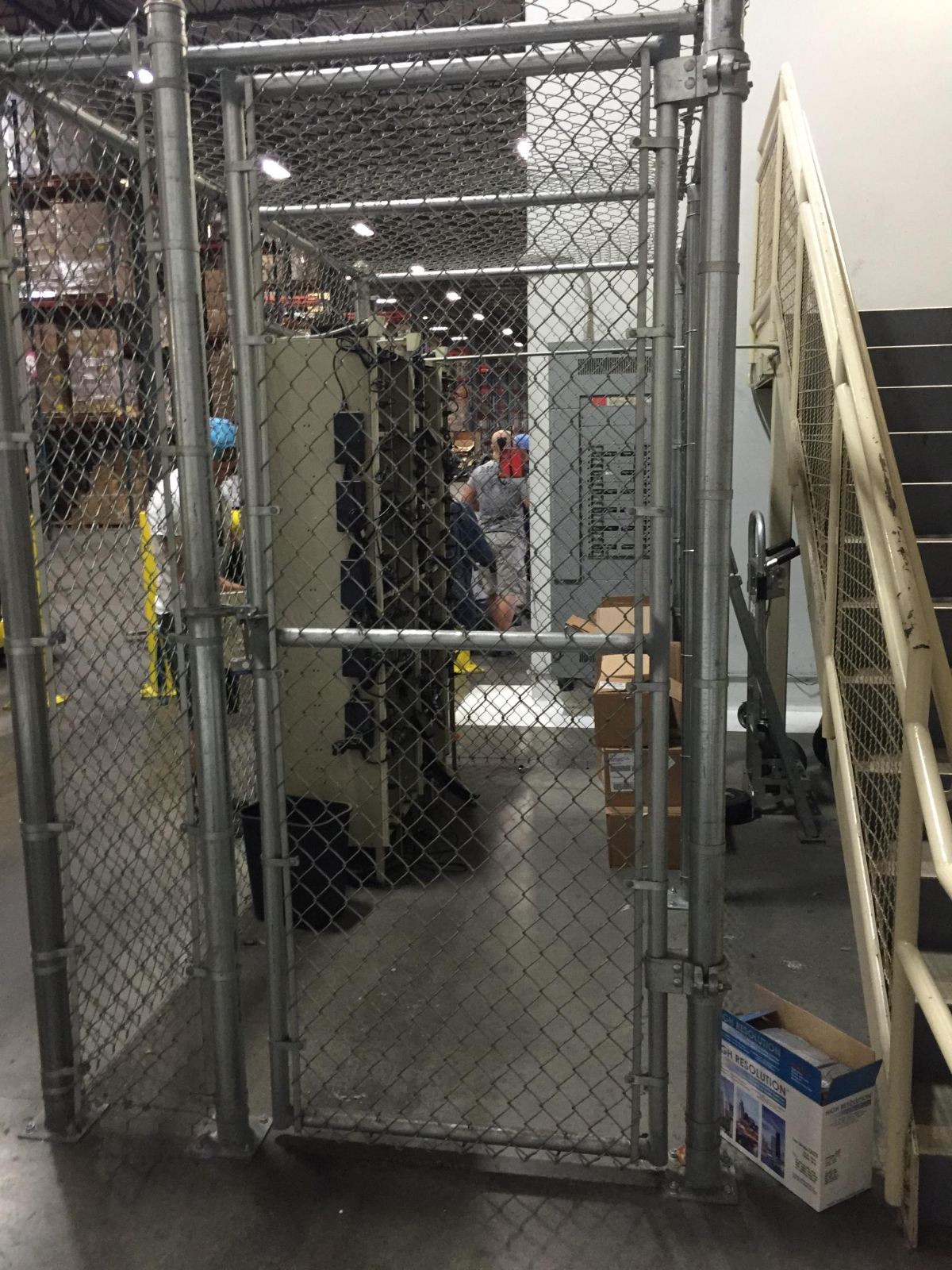 8-foot-high chain link interior enclosures with walk gate and enclosed top