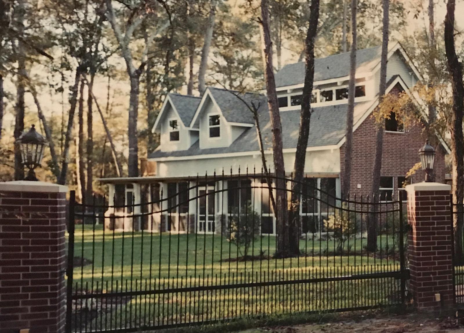 Custom ornamental iron entrance gate, operated