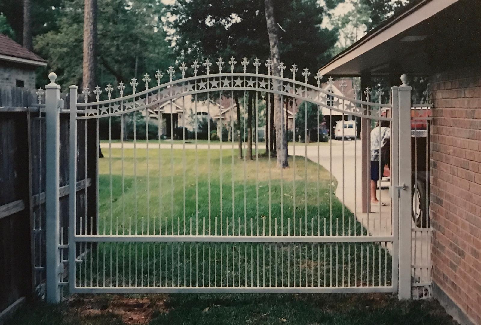 Custom ornamental iron entrance gate, operated