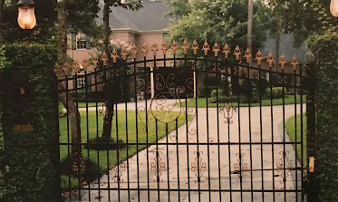 Ornamental iron driveway gate