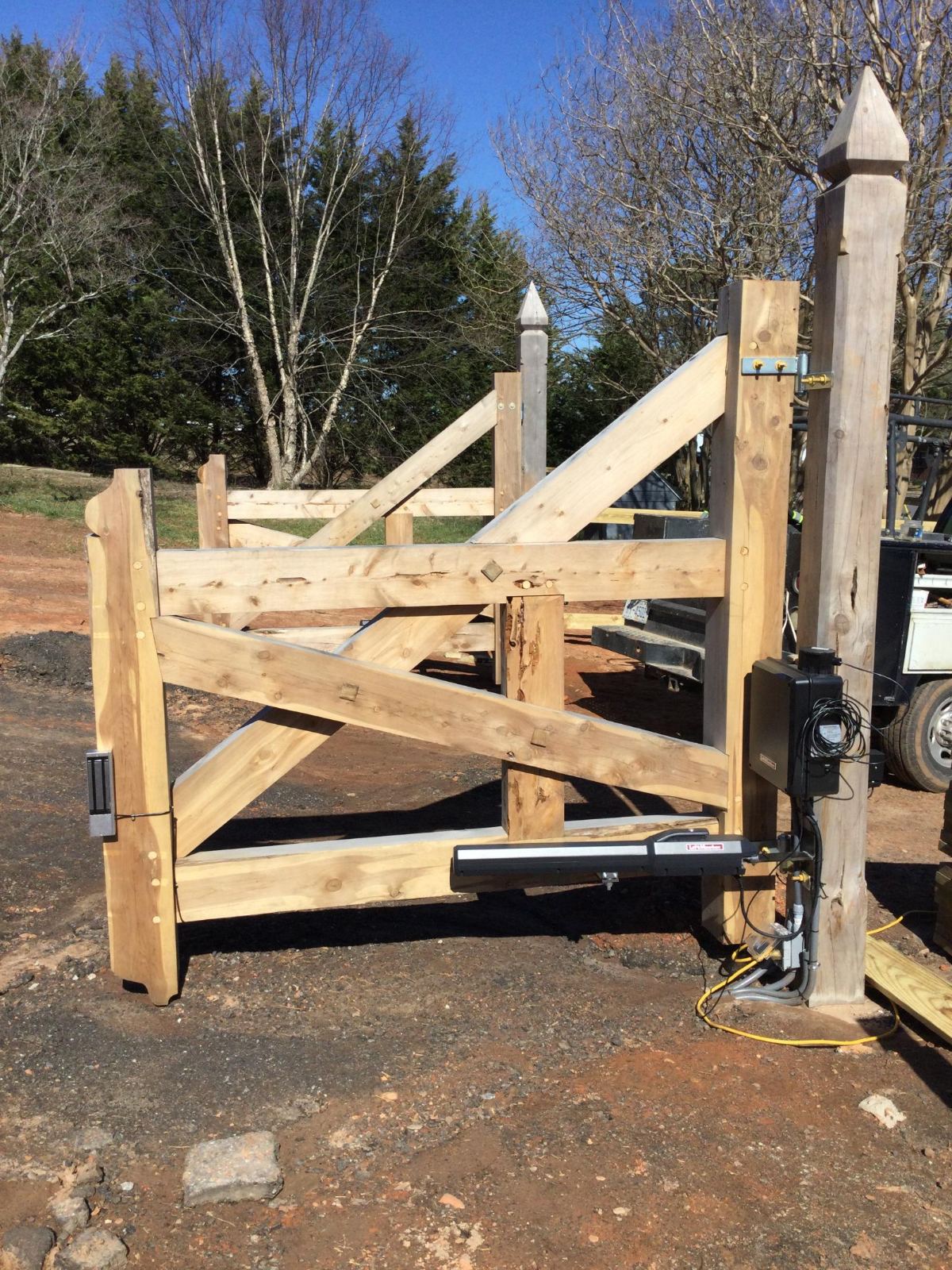 Custom timber entrance gate with automatic operator