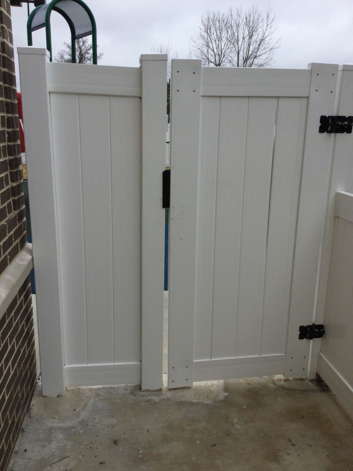 6-foot by 4-foot white vinyl walk gate with self-closing hinges and latch