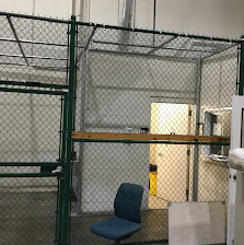 Green indoor chain link enclosure
