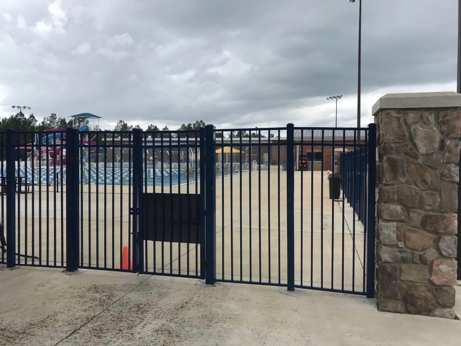 6-foot high blue aluminum fence double gate at pool deck at YMCA Clover Lake Wylie Aquatics Center